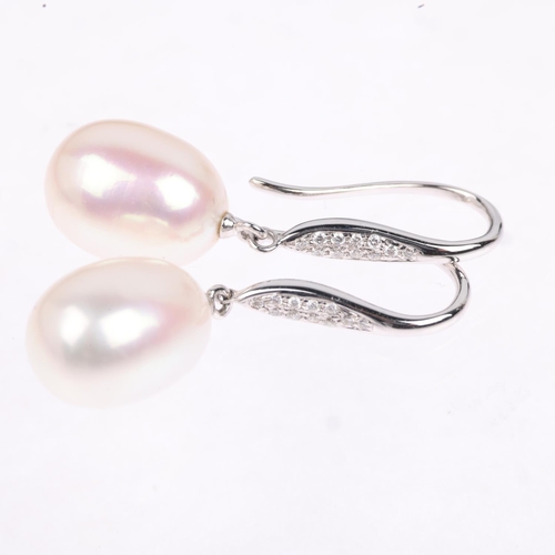 1291 - A pair of 9ct white gold whole pearl and diamond drop earrings, with shepherd hook fittings, 31mm, 4... 