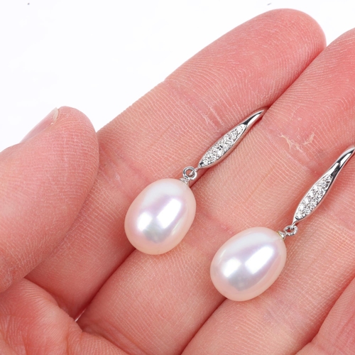 1291 - A pair of 9ct white gold whole pearl and diamond drop earrings, with shepherd hook fittings, 31mm, 4... 