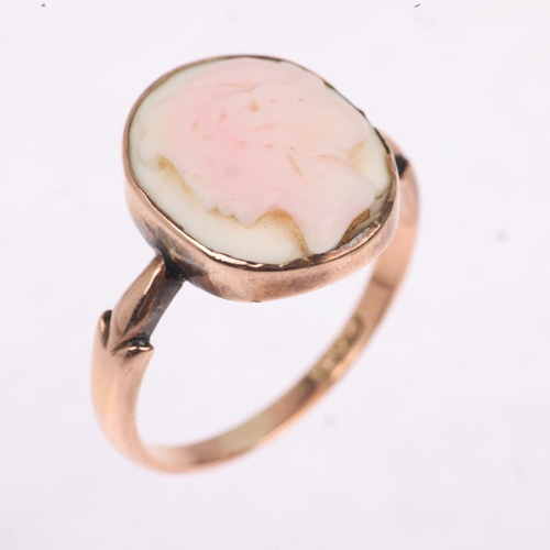 1292 - A Vintage 9ct rose gold pink coral cameo ring, relief carved depicting female profile, setting heigh... 