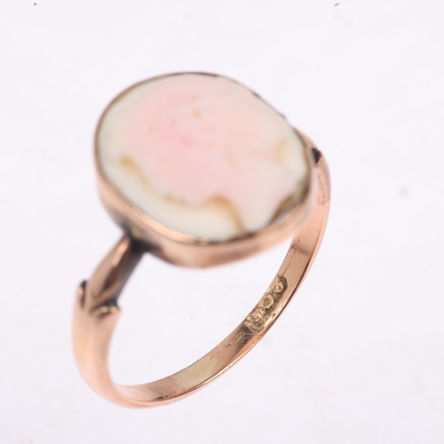 1292 - A Vintage 9ct rose gold pink coral cameo ring, relief carved depicting female profile, setting heigh... 