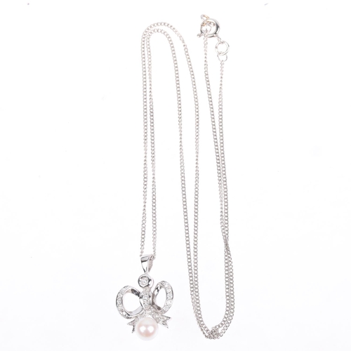 1301 - A modern whole pearl and diamond ribbon bow matching pendant necklace and earring set, set with mode... 