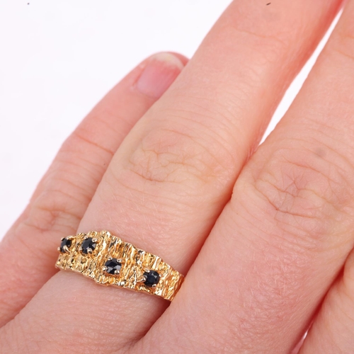 1303 - A 1970s 9ct gold sapphire band ring, London 1977, textured bark decoration, setting height 7.5mm, si... 