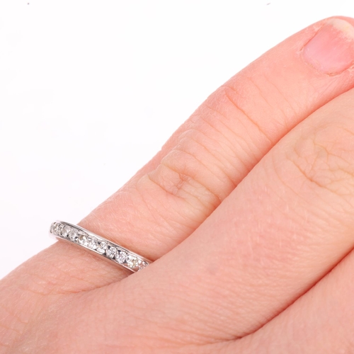 1304 - A diamond eternity ring, set with modern round brilliant-cut diamonds, total diamond content approx ... 