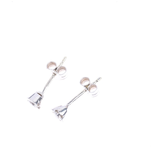 1305 - A pair of 9ct white gold 0.2ct solitaire diamond earrings, each set with 0.1ct modern round brillian... 