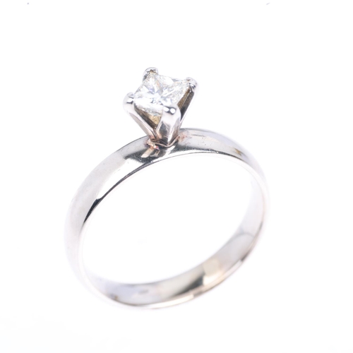 1312 - A 14ct white gold 0.7ct solitaire diamond ring, set with Princess-cut diamond, colour approx I/J, cl... 