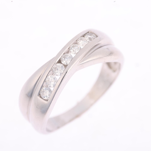 1313 - An 18ct white gold diamond crossover band ring, channel set with modern round brilliant-cut diamonds... 