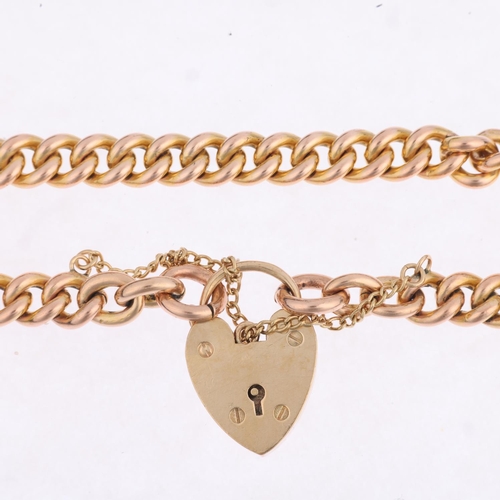 1334 - A 9ct rose gold solid curb link chain bracelet, with 9ct heart padlock clasp, maker JH&S, Birmingham... 