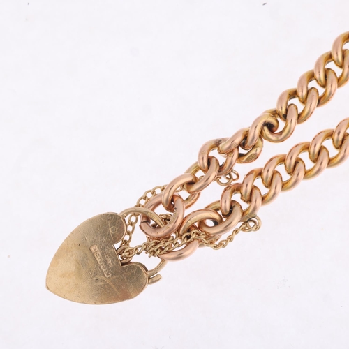 1334 - A 9ct rose gold solid curb link chain bracelet, with 9ct heart padlock clasp, maker JH&S, Birmingham... 