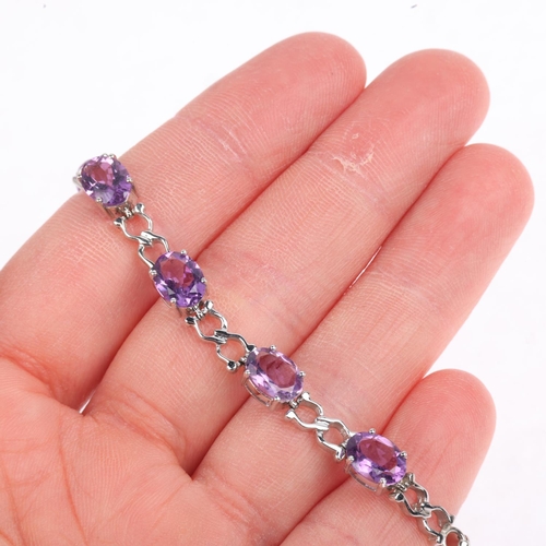 1343 - A modern 9ct white gold amethyst tennis line bracelet, 17cm, 9.9g