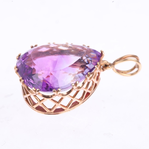 1352 - A late 20th century French 9ct gold amethyst drop pendant, claw set with 24ct pear-cut amethyst, 35.... 