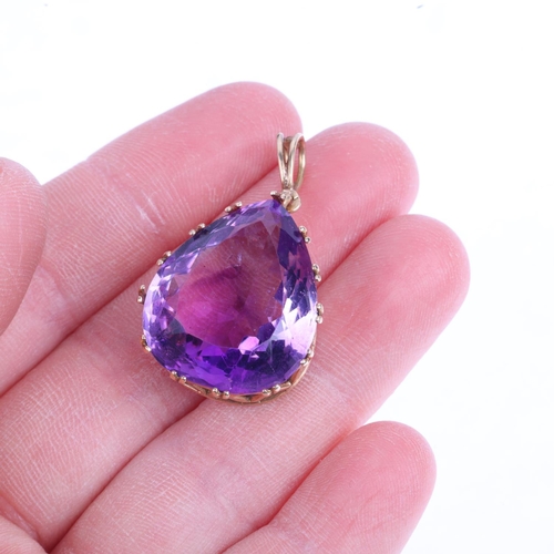 1352 - A late 20th century French 9ct gold amethyst drop pendant, claw set with 24ct pear-cut amethyst, 35.... 