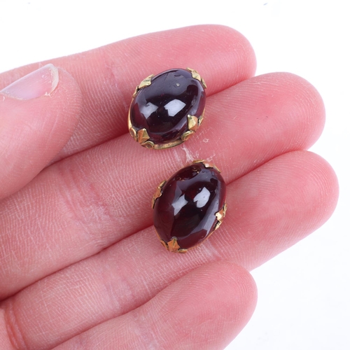 1357 - A pair of garnet earrings, with fleur-de-lis stud fittings, apparently unmarked, 15.5mm, 8g