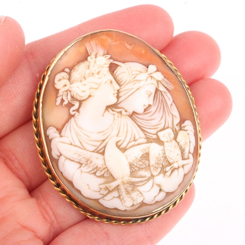 1359 - A 19th century shell 'Eos and Nyx' cameo brooch, relief carved depicting Goddesses, in unmarked yell... 