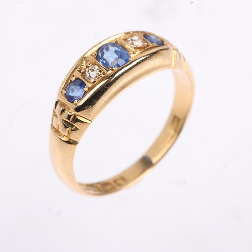 1369 - An early 20th century 18ct gold graduated five stone sapphire and diamond half hoop ring, indistinct... 