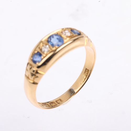 1369 - An early 20th century 18ct gold graduated five stone sapphire and diamond half hoop ring, indistinct... 