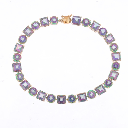 1380 - A modern 9ct gold mystic topaz tennis line bracelet, 20cm, 12g