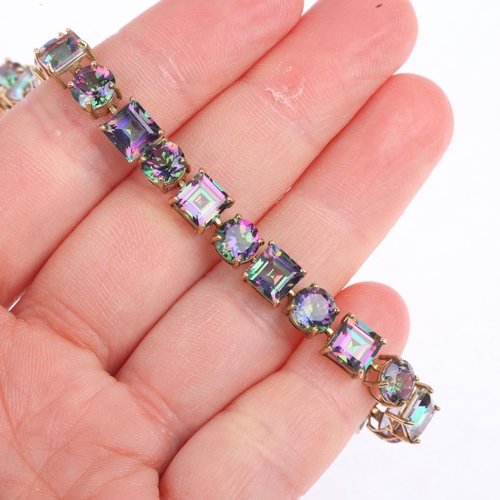 1380 - A modern 9ct gold mystic topaz tennis line bracelet, 20cm, 12g