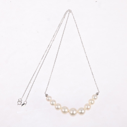 1394 - A modern 9ct white gold graduated pearl line necklace, largest pearl 8.2mm, 44cm, 5.1g