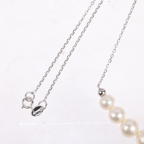 1394 - A modern 9ct white gold graduated pearl line necklace, largest pearl 8.2mm, 44cm, 5.1g