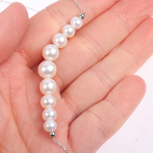 1394 - A modern 9ct white gold graduated pearl line necklace, largest pearl 8.2mm, 44cm, 5.1g