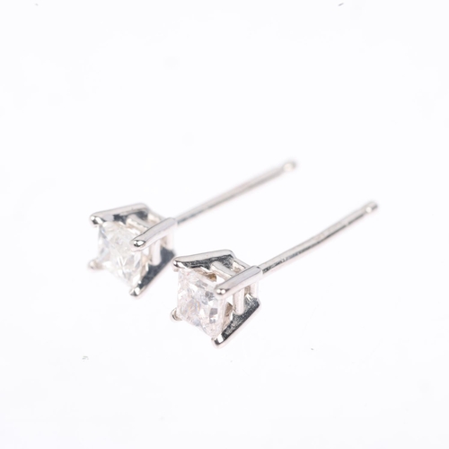 1401 - A pair of 14ct white gold 0.2ct solitaire diamond earrings, each set with 0.1ct Princess-cut diamond... 