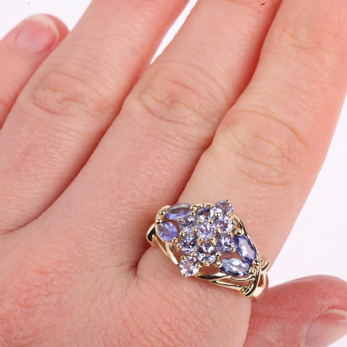 1407 - A 9ct gold tanzanite cluster dress ring, setting height 14.7mm, size P, 4.1g