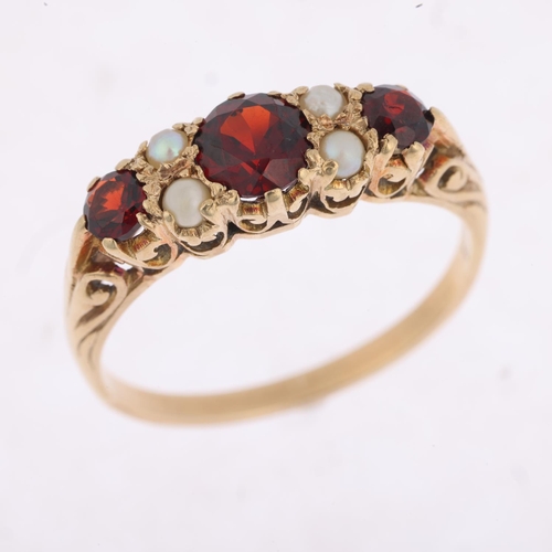 1410 - A mid-20th century 9ct gold seven stone garnet and pearl half hoop ring, London 1963, setting height... 