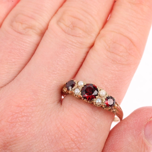 1410 - A mid-20th century 9ct gold seven stone garnet and pearl half hoop ring, London 1963, setting height... 