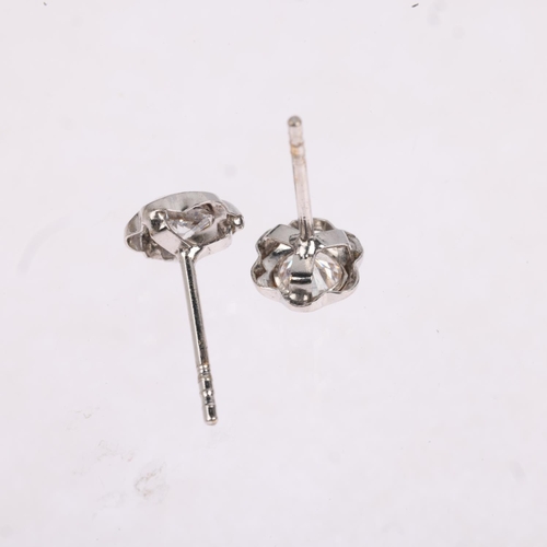 1420 - A pair of 0.2ct solitaire diamond flowerhead earrings, each set with 0.1ct modern round brilliant-cu... 