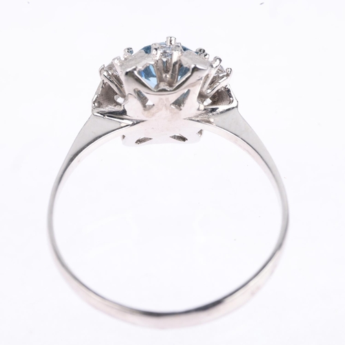 1425 - An 18ct white gold blue and white topaz flowerhead dress ring, setting height 10.7mm, size Q, 2.9g