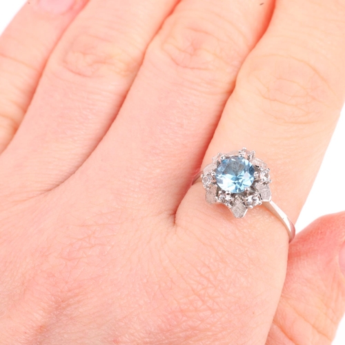 1425 - An 18ct white gold blue and white topaz flowerhead dress ring, setting height 10.7mm, size Q, 2.9g