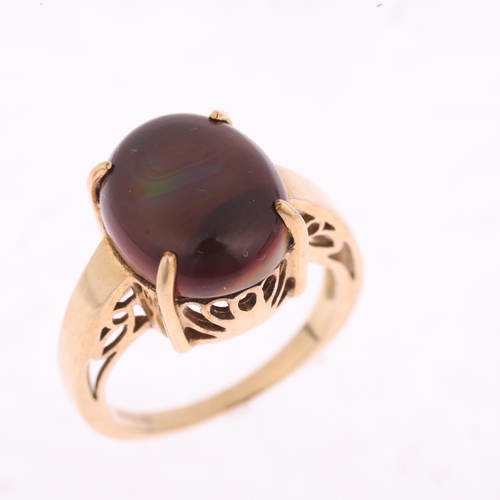 1426 - A 9ct gold ammolite dress ring, maker GTV, Birmingham 2005, claw set with oval cabochon ammolite, se... 