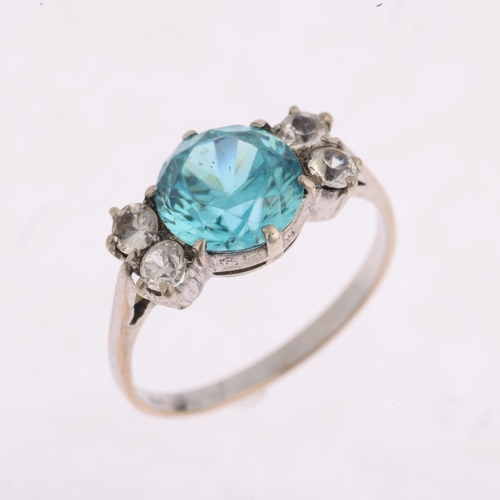 1428 - A Vintage blue zircon and white sapphire dress ring, set with 8mm zircon, apparently unmarked, setti... 