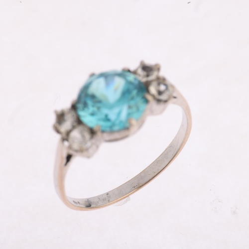 1428 - A Vintage blue zircon and white sapphire dress ring, set with 8mm zircon, apparently unmarked, setti... 