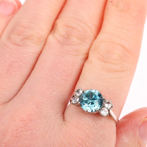 1428 - A Vintage blue zircon and white sapphire dress ring, set with 8mm zircon, apparently unmarked, setti... 