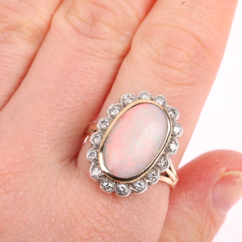 1430 - A late 20th century opal and diamond oval cluster ring, centrally set with 2.4ct oval cabochon white... 