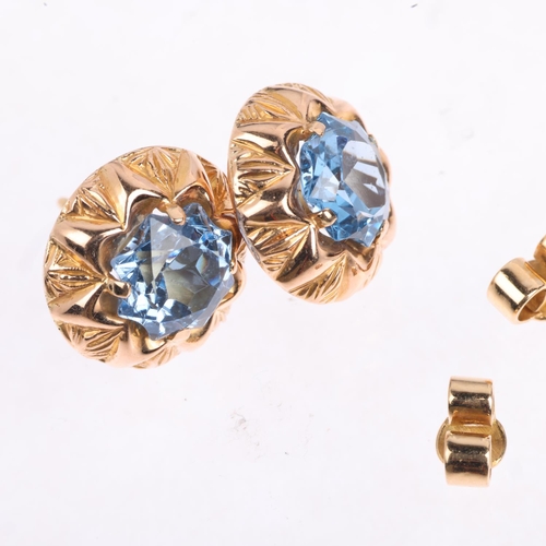 1433 - A pair of 18ct gold blue paste flowerhead earrings, with stud fittings, 13.8mm, 4.7g