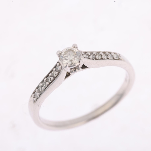 1439 - A modern 9ct white gold 0.15ct solitaire diamond ring, claw set with modern round brilliant-cut diam... 