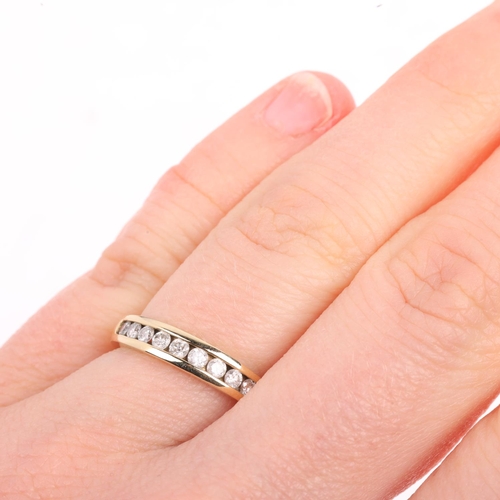 1443 - A 9ct gold diamond half eternity ring, channel set with modern round brilliant-cut diamonds, total d... 