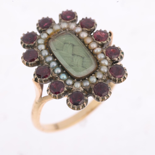 1445 - A Georgian 9ct gold flat-top garnet split pearl and hairwork mourning ring, circa 1820, central gree... 