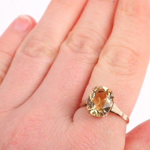 1463 - A mid-20th century 9ct gold citrine dress ring, set with oval mixed-cut citrine, setting height 11.1... 