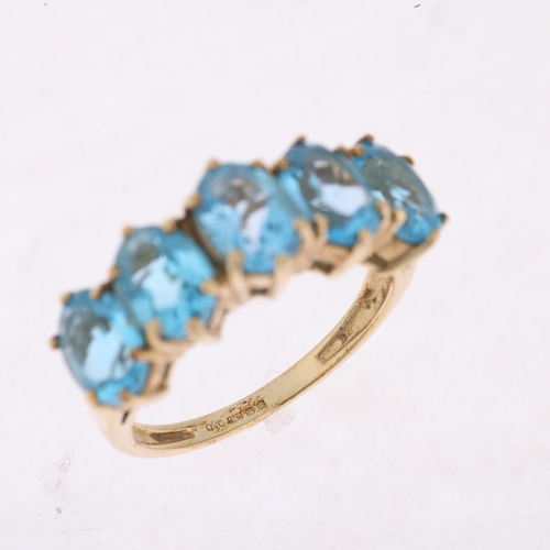 1465 - A 9ct gold five stone blue topaz half hoop ring, setting height 8mm, size M, 3.4g