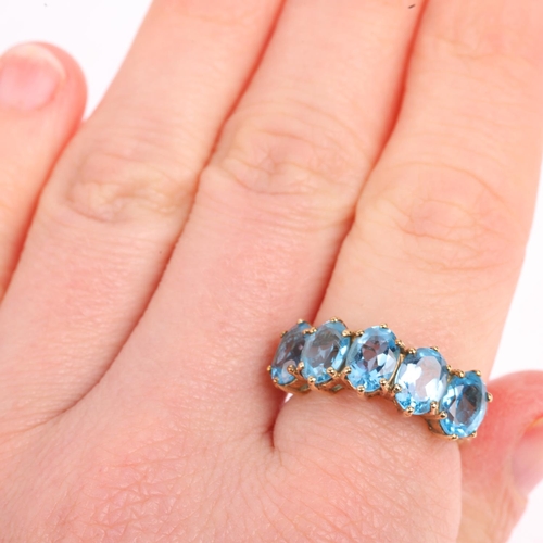 1465 - A 9ct gold five stone blue topaz half hoop ring, setting height 8mm, size M, 3.4g