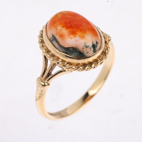 1466 - A 1970s 9ct gold moss agate dress ring, maker S&Co, Birmingham 1972, set with oval cabochon agate, s... 