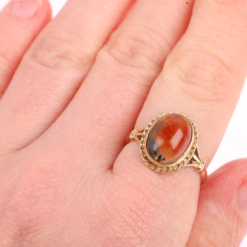 1466 - A 1970s 9ct gold moss agate dress ring, maker S&Co, Birmingham 1972, set with oval cabochon agate, s... 