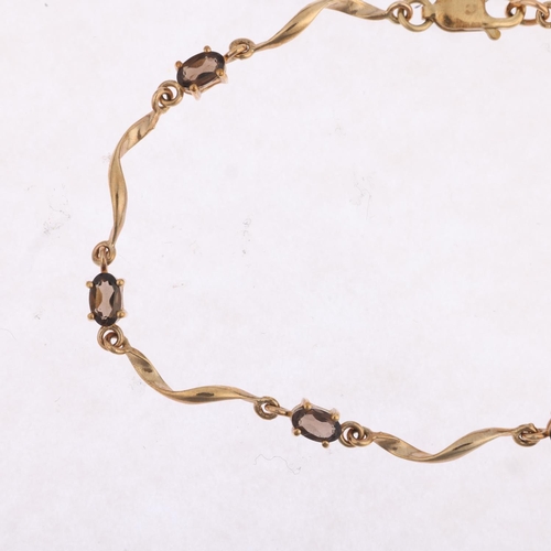 1481 - A 9ct gold smoky quartz tennis line bracelet, 18cm, 3.5g