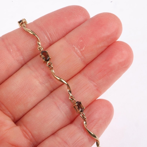 1481 - A 9ct gold smoky quartz tennis line bracelet, 18cm, 3.5g