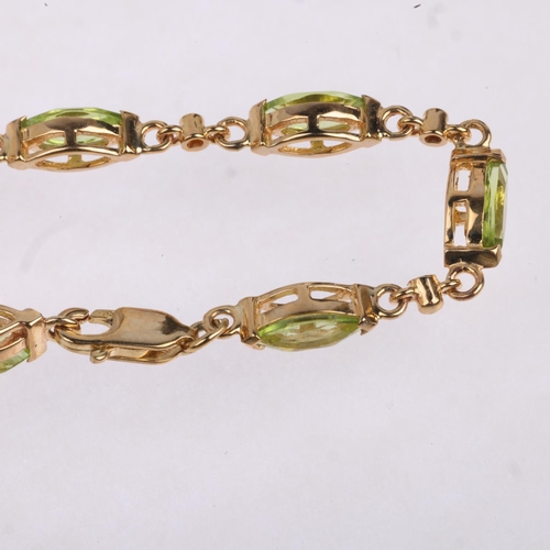 1485 - A 9ct gold peridot tennis line bracelet, set with marquise-cut peridot, 18cm, 6.2g