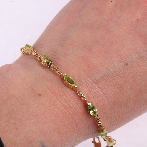 1485 - A 9ct gold peridot tennis line bracelet, set with marquise-cut peridot, 18cm, 6.2g