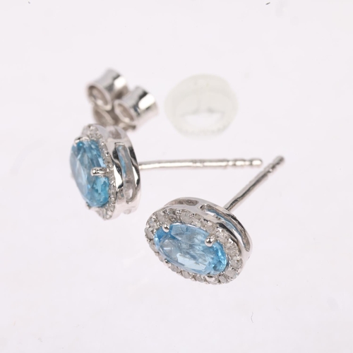 1495 - A pair of 9ct white gold aquamarine and diamond oval cluster earrings, with stud fittings, 8.3mm, 1.... 